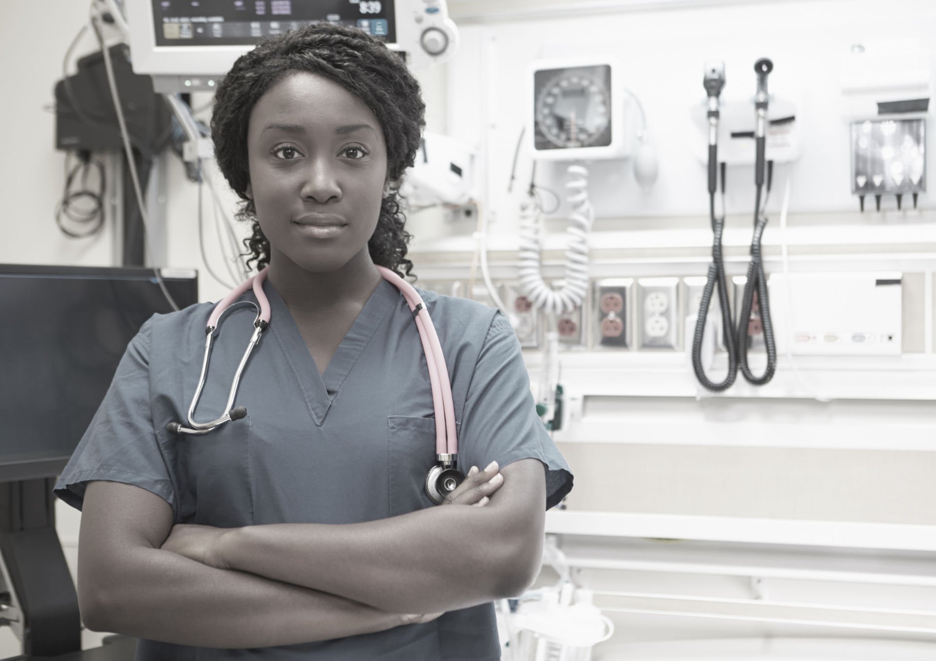 black-woman-nurse-standing-with-arms-folded